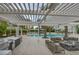 Outdoor kitchen area with a grill, seating and dining spaces by the pool, perfect for entertaining at 2777 Paradise Rd # 301, Las Vegas, NV 89109