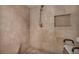 Walk-in shower with beige tile and a built-in seat at 2777 Paradise Rd # 301, Las Vegas, NV 89109