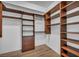 Spacious walk-in closet with custom wood shelving, drawers, and hanging rods at 2777 Paradise Rd # 301, Las Vegas, NV 89109