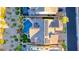 A stunning aerial view reveals a private backyard oasis with pool, solar panels, and lush landscaping at 28 Vista Outlook St, Henderson, NV 89011