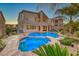 Expansive backyard showcasing the pool, spa, and covered patio of this beautiful home at 28 Vista Outlook St, Henderson, NV 89011