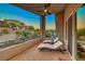 Relaxing covered balcony with stylish lounge seating and lovely views at 28 Vista Outlook St, Henderson, NV 89011