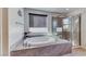 A luxurious bathroom features a soaking tub with gray tile surround and a glass-enclosed shower at 28 Vista Outlook St, Henderson, NV 89011