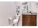 A well-appointed powder room features a granite counter, undermount sink, and stylish fixtures at 28 Vista Outlook St, Henderson, NV 89011