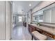 Bright bathroom with large vanity, separate tub and shower, and neutral colors at 28 Vista Outlook St, Henderson, NV 89011