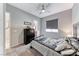 Bedroom with ceiling fan, dresser, and large bed at 28 Vista Outlook St, Henderson, NV 89011