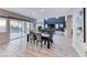Open dining and living room area with an expansive view of the outdoor pool area at 28 Vista Outlook St, Henderson, NV 89011