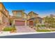 Beautiful two-story home boasting a three-car garage and a well-maintained, landscaped front yard at 28 Vista Outlook St, Henderson, NV 89011