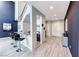 Elegant foyer with high ceilings, dark accent wall, and staircase leading to the upper level at 28 Vista Outlook St, Henderson, NV 89011