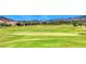 Scenic view of the lush green golf course, showcasing its well-maintained fairways and beautiful surroundings at 28 Vista Outlook St, Henderson, NV 89011