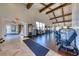 Spacious gym with high ceilings, exposed beams, and a variety of modern exercise equipment at 28 Vista Outlook St, Henderson, NV 89011