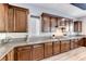 Kitchen features granite counters, wood cabinets, and stainless steel hood at 28 Vista Outlook St, Henderson, NV 89011