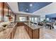 Kitchen and dining area featuring an island with bar stools and stainless steel appliances at 28 Vista Outlook St, Henderson, NV 89011
