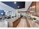 Gourmet kitchen with wood cabinets, granite countertops, and stainless steel appliances at 28 Vista Outlook St, Henderson, NV 89011
