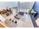 Spacious open-concept living area with large windows, a dining area, and access to outdoor pool at 28 Vista Outlook St, Henderson, NV 89011