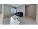 Living room with sofa, large window, and wood floors at 28 Vista Outlook St, Henderson, NV 89011