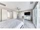 Main bedroom showcasing sliding glass door, ensuite access, and large windows at 28 Vista Outlook St, Henderson, NV 89011