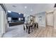 Spacious open-concept living space with a dining area, living room, and modern kitchen at 28 Vista Outlook St, Henderson, NV 89011