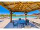 Community pool featuring a cabana with seating and lounge chairs with beautiful mountain views at 28 Vista Outlook St, Henderson, NV 89011