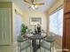 Charming dining area with a marble table, comfortable seating, and natural light, perfect for enjoying meals with Gathering and friends at 3038 Tarpon Dr # 103, Las Vegas, NV 89120