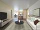 Bright living room with modern decor, open floor plan, and stylish furnishings, creating an inviting and comfortable space at 3038 Tarpon Dr # 103, Las Vegas, NV 89120