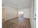 Spacious living room featuring wood-look floors and sliding glass doors to the outside at 3038 Tarpon Dr # 103, Las Vegas, NV 89120