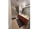 Bright bathroom boasts a double sink vanity, full mirror, and a shower-tub combination with tile surround at 312 Sierra Breeze Ave, North Las Vegas, NV 89031
