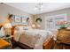 Charming bedroom with a decorative bed, floral accents, and natural light from the shuttered windows at 3185 Mura Del Prato Ave, Henderson, NV 89044
