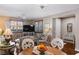 Inviting living room featuring wood floors, neutral color scheme and comfortable seating with natural light at 3185 Mura Del Prato Ave, Henderson, NV 89044