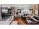 Comfortable living area with hardwood floors, leather seating, and decorative shelving at 3185 Mura Del Prato Ave, Henderson, NV 89044
