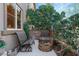 Cozy patio area with comfortable seating, stone fire pit, and lush landscaping for relaxation at 3185 Mura Del Prato Ave, Henderson, NV 89044