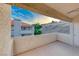 Outdoor patio with stucco walls and views of neighboring buildings and hillside at 331 Seine Way # 331, Henderson, NV 89014