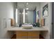 Bathroom featuring a modern vanity, illuminated mirrors, and decorative accents at 3726 Las Vegas Blvd # 609, Las Vegas, NV 89158