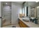 Bright bathroom showcasing a modern vanity, sleek fixtures, and a glass-enclosed walk-in shower at 3726 Las Vegas Blvd # 609, Las Vegas, NV 89158