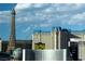 Expansive city view features the Eiffel Tower replica and iconic Las Vegas strip hotels under a bright blue partly cloudy sky at 3726 Las Vegas Blvd # 609, Las Vegas, NV 89158