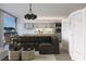 Stylishly furnished living room with kitchen view, modern lighting, and contemporary decor, virtually staged at 3726 Las Vegas Blvd # 609, Las Vegas, NV 89158