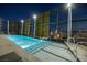 Rooftop pool with city views at night, featuring glowing blue water, metal railings, and glimpses of city lights at 3726 Las Vegas Blvd # 609, Las Vegas, NV 89158