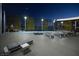 Rooftop pool deck at night with a pool, lounge chairs, and a panoramic view of the city skyline at 3726 Las Vegas Blvd # 609, Las Vegas, NV 89158