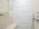 Walk-in shower featuring neutral tile, built-in bench, and sleek shower fixtures at 3726 Las Vegas Blvd # 609, Las Vegas, NV 89158