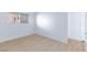 Cozy bedroom with wood floors, base molding, and natural light from the window at 3821 1/2 Daisy St # 26, Las Vegas, NV 89119