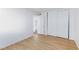 Bedroom featuring wood floors, base molding, and a closet with sliding doors at 3821 1/2 Daisy St # 26, Las Vegas, NV 89119