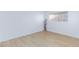 Bright bedroom features light wood floors and a window for natural light at 3821 1/2 Daisy St # 26, Las Vegas, NV 89119