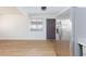 View of home's bright, airy entryway, complete with wood-look flooring and a stainless steel refrigerator at 3821 1/2 Daisy St # 26, Las Vegas, NV 89119