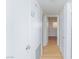Hallway features bright white walls, closet space, and wood-look flooring at 3821 1/2 Daisy St # 26, Las Vegas, NV 89119