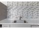 Kitchen with updated countertops, gray cabinets with modern silver pulls, and a stainless steel sink at 3821 1/2 Daisy St # 26, Las Vegas, NV 89119