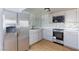 Kitchen featuring grey shaker cabinets, white countertops, and stainless appliances at 3821 1/2 Daisy St # 26, Las Vegas, NV 89119