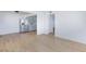 A view into an apartment living area with modern wood-look floors and open plan at 3821 1/2 Daisy St # 26, Las Vegas, NV 89119