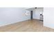 Apartment with new floors showing the gray front door and stainless refrigerator at 3821 1/2 Daisy St # 26, Las Vegas, NV 89119