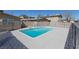 Community swimming pool surrounded by a metal fence for added security at 3821 1/2 Daisy St # 26, Las Vegas, NV 89119