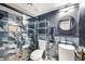Modern bathroom with sleek black marble tile shower, vanity, and minimalist shelving at 3911 Kamden Way, Las Vegas, NV 89119